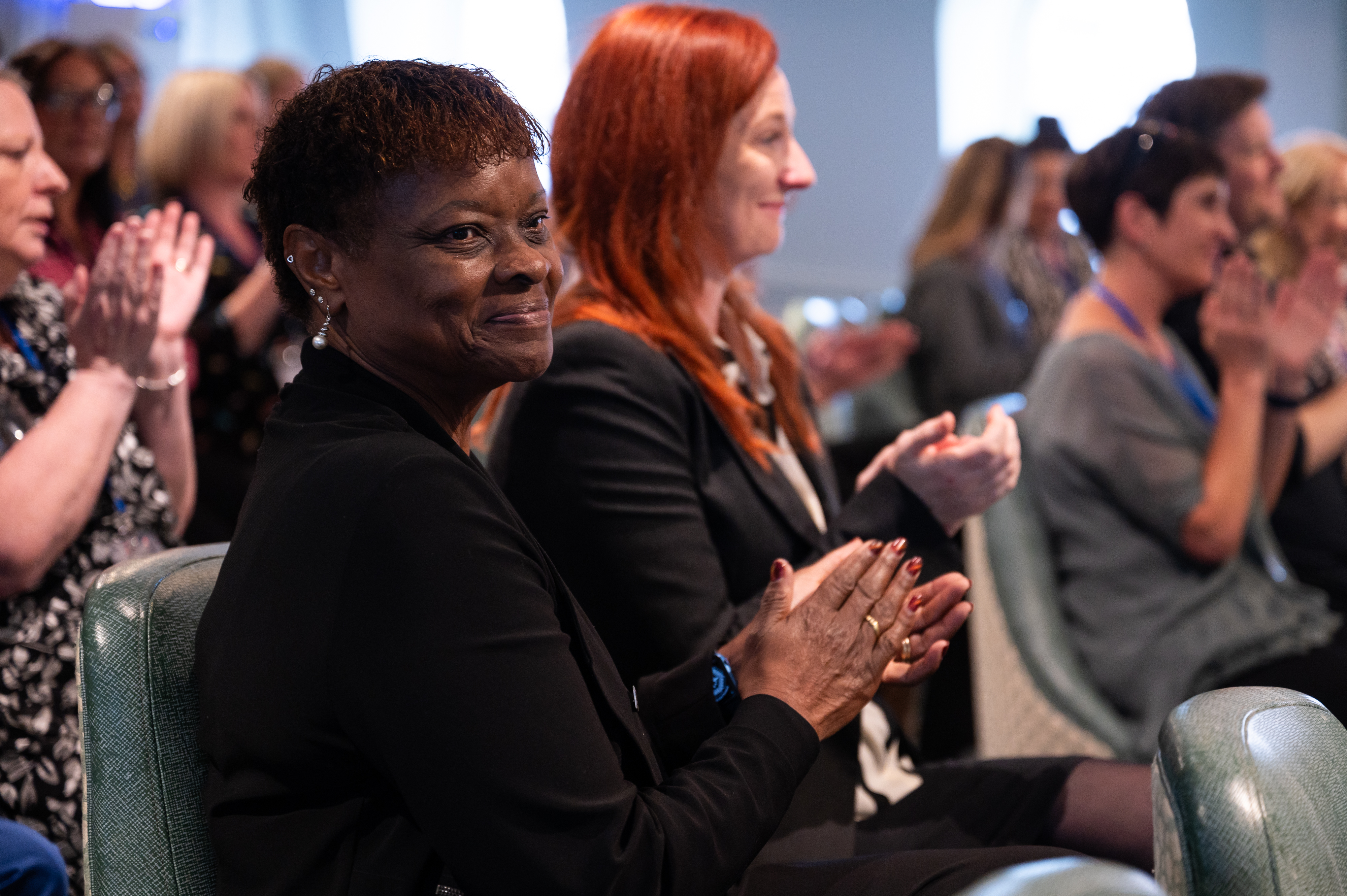 Hebe and Alyson smiling and applauding