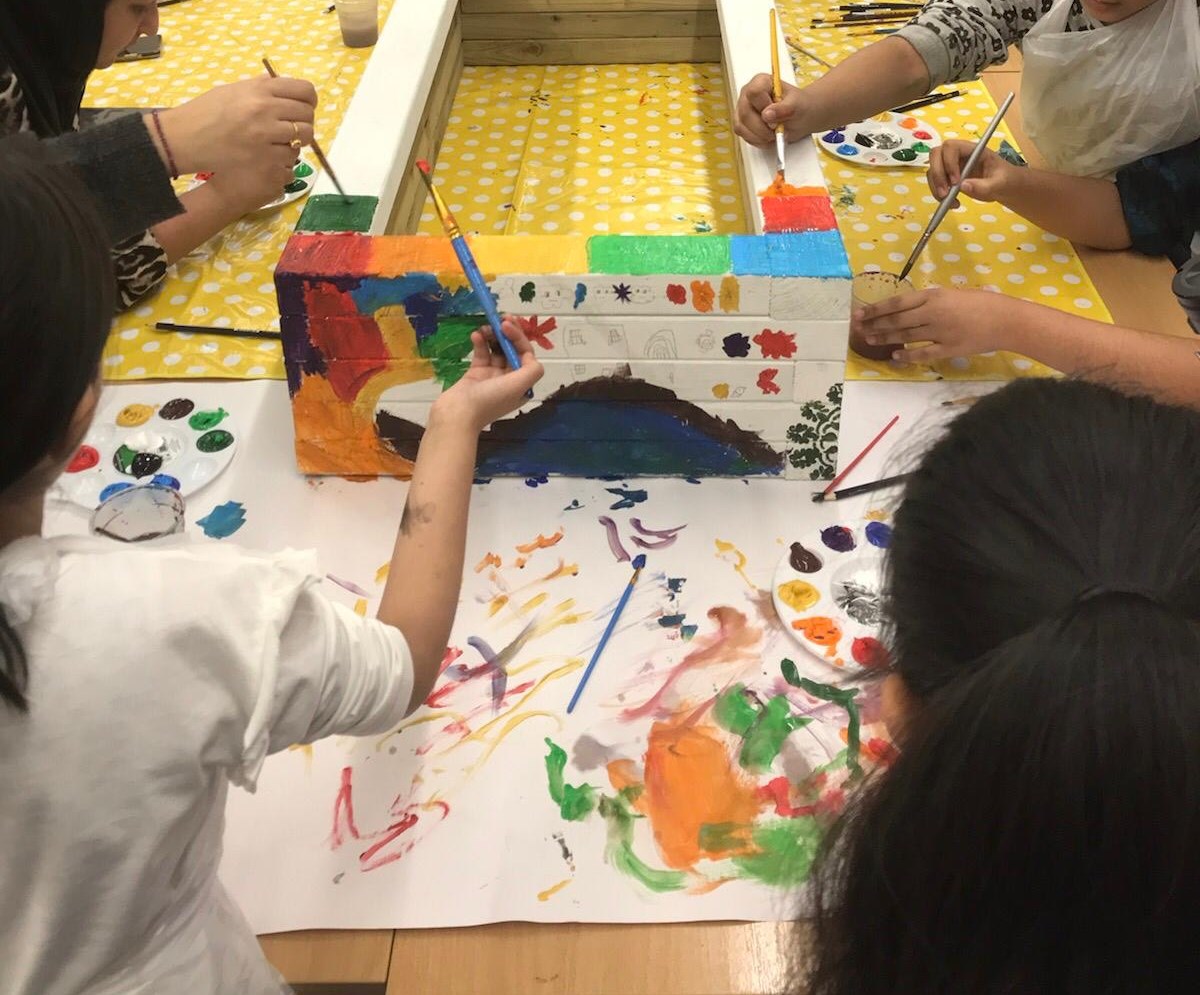 families painting in a workshop