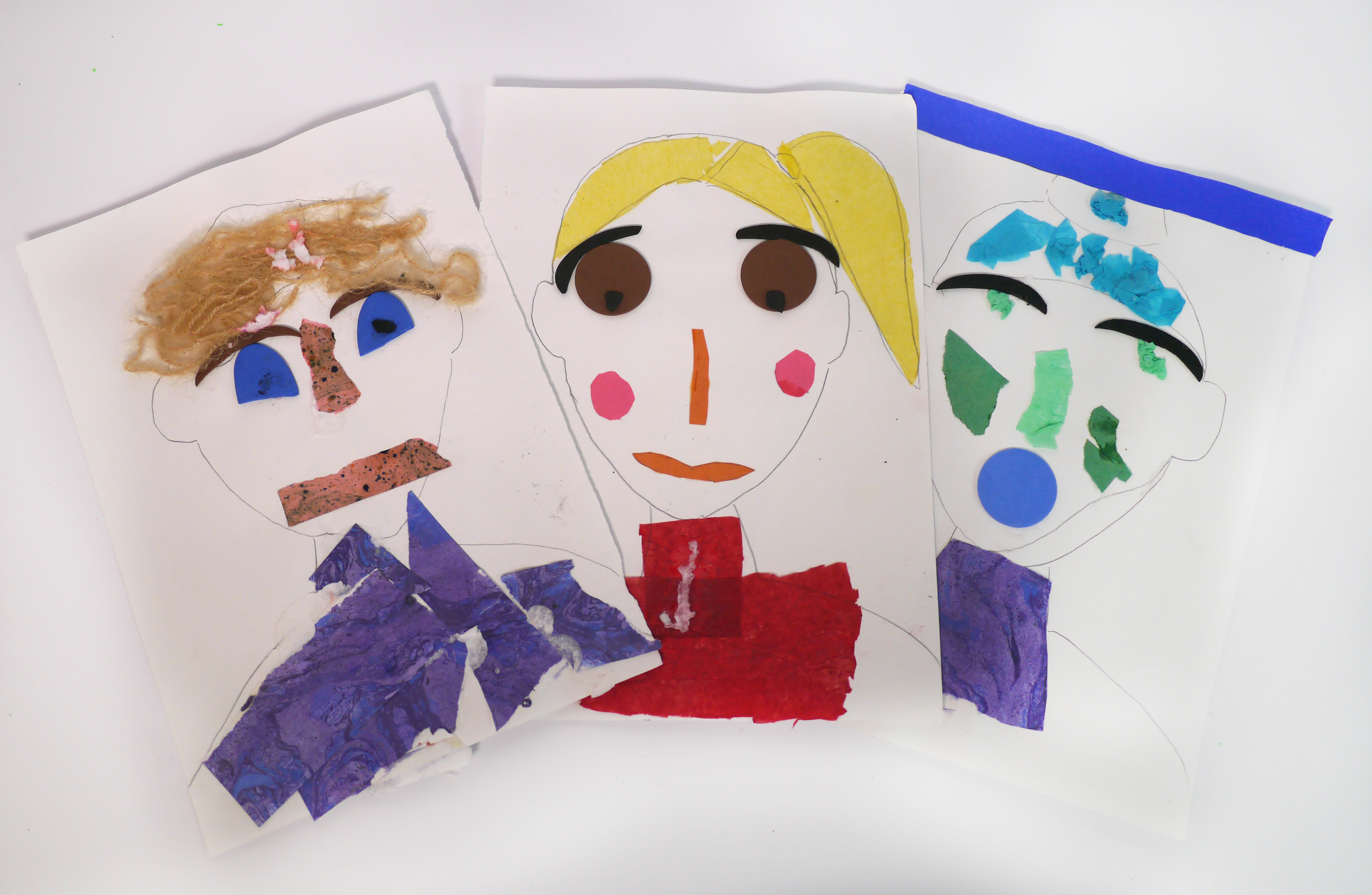 This image shows 3 decorated paper faces 
