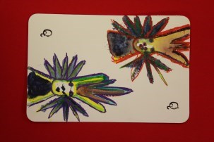 This image is of two decorated flowers one in the top corner of the page and one at the bottom corner